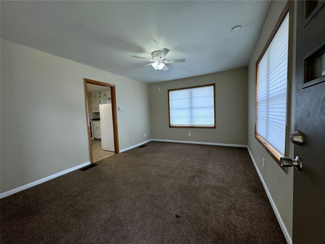 Unit A living room with view of kitchen | Image 11