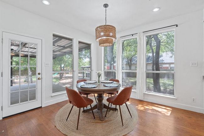 Dining area featuring a chandelier, hardwood / wood-style flooring, and recessed lighting | Image 14