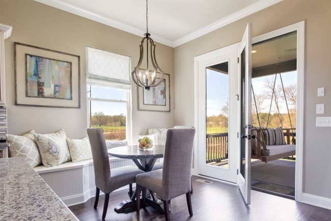 The breakfast room opens to the covered porch. | Image 28