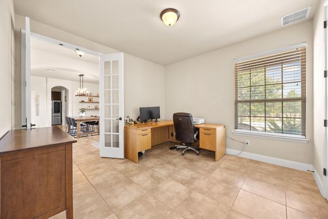 Office on main floor with two french doors | Image 21