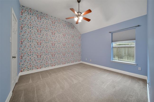 The secondary bedrooms are spacious and bright with generous closet space. | Image 21