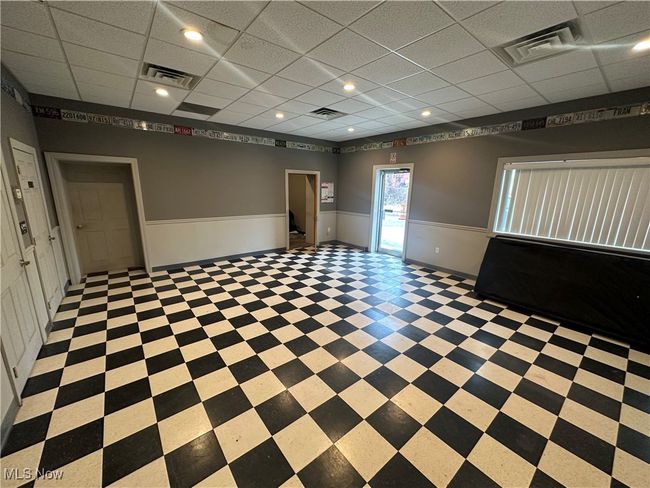 Unfurnished room featuring a drop ceiling | Image 10