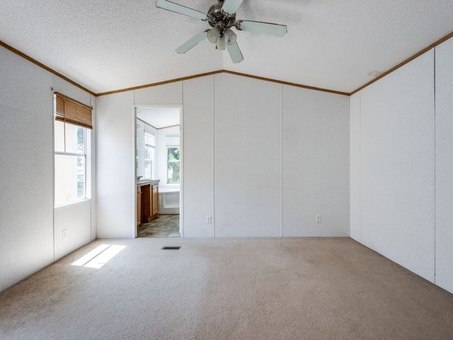 Spacious primary bedroom has ensuite bath with garden tub and shower. | Image 30