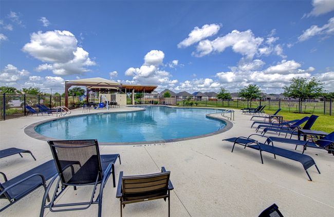 Community pool featuring a patio area | Image 33
