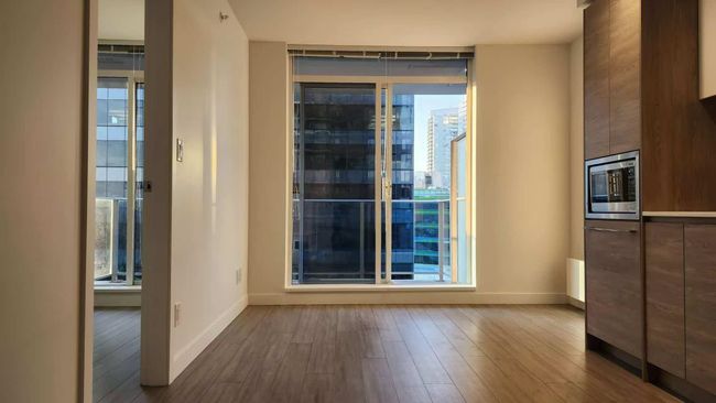 Interior space with plenty of natural light and wood finished floors | Image 12