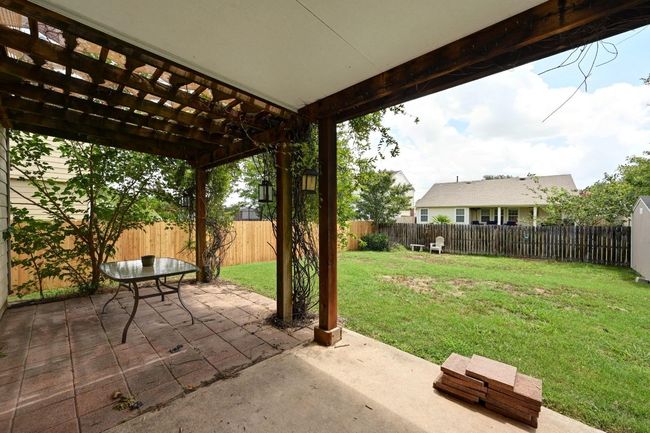 Fenced backyard with a patio and a pergola | Image 30