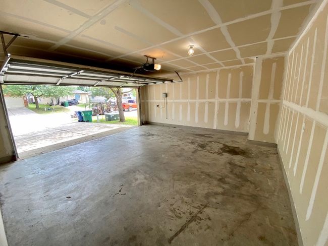 Garage with a garage door opener | Image 28