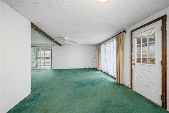 Carpeted spare room with ceiling fan | Image 15
