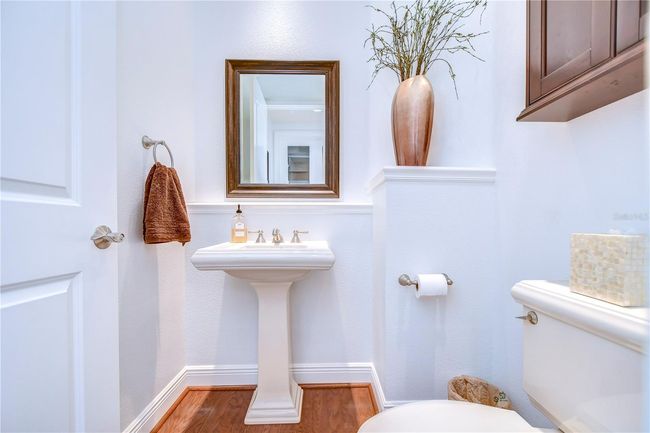 Pristine powder room, where sleek design meets practicality | Image 9