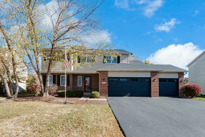 Brick and Vynil Exterior, fresh asphalt driveway | Image 1