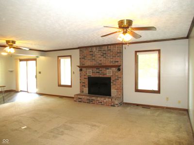 Large Inviting Great Room Displays a beautiful Wood Burnig Fireplace | Image 2