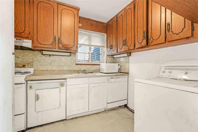 Laundry area with washer / clothes dryer and light flooring | Image 11