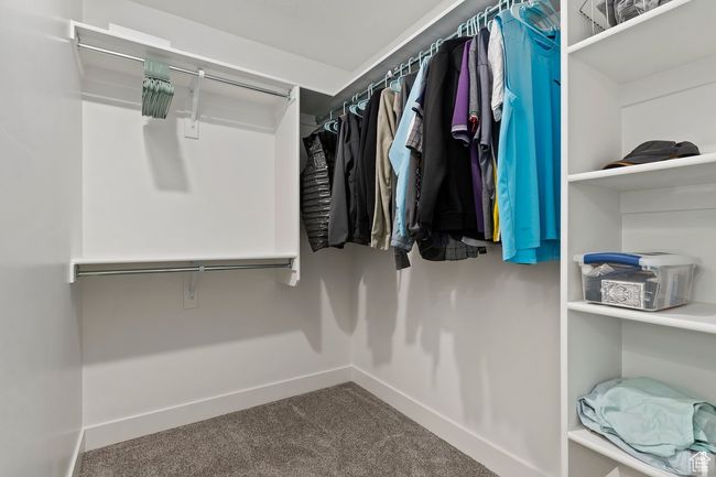 Walk in closet with carpet floors | Image 16