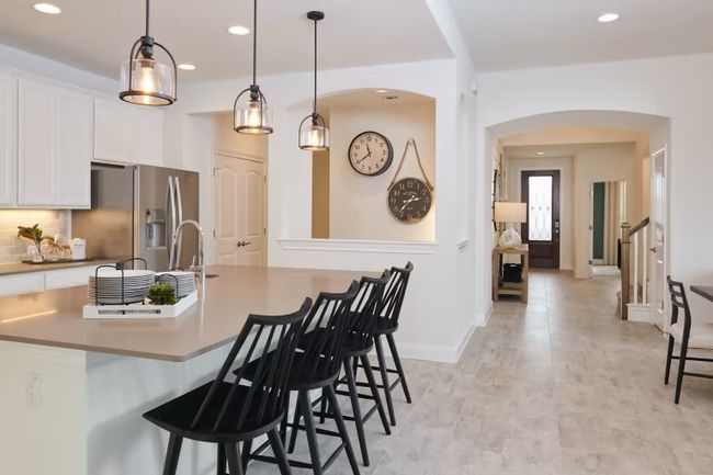 Photo of Pulte model home with same floor plan, not of actual home listed. | Image 9