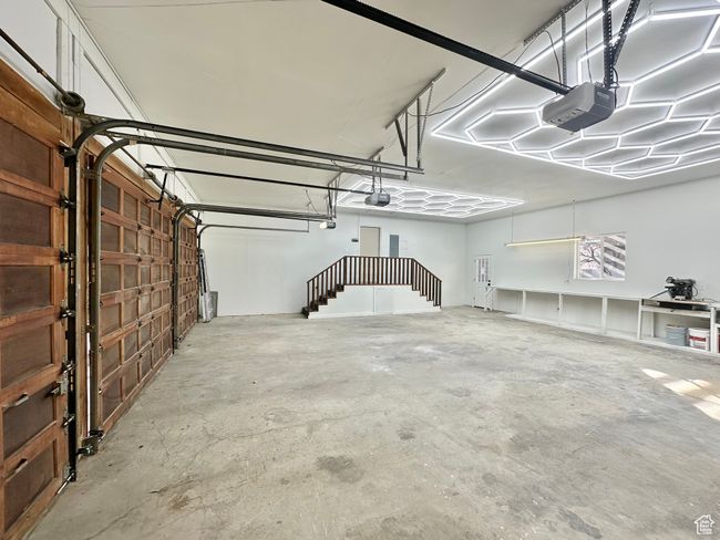 Garage featuring a garage door opener | Image 44