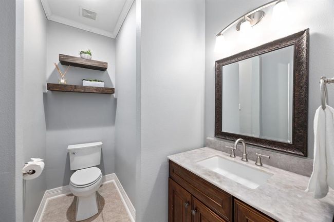 Downstairs half bath with Taj Mahal quartzite counters. | Image 31