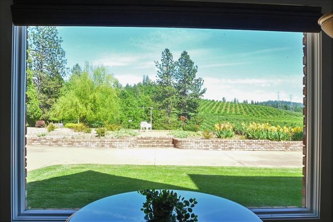 Oh what a view, circular driveway with rock wall. | Image 18