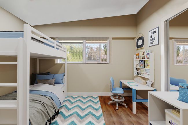 Bedroom with baseboards and wood finished floors | Image 9