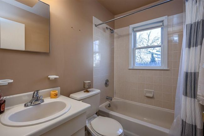 Full bath featuring vanity and shower / tub combo with curtain | Image 27