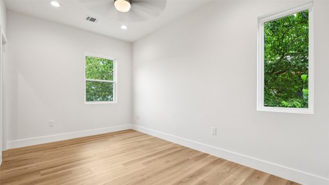 Spare room with wood finished floors, recessed lighting, and ceiling fan | Image 19