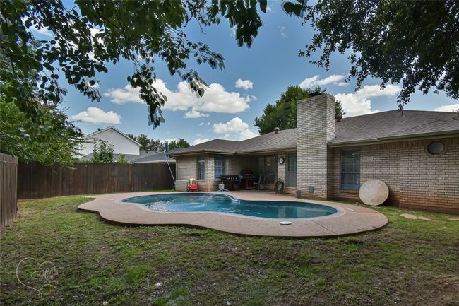 View of pool featuring a fenced backyard and a patio area | Image 8