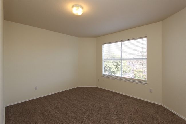 Empty room with dark colored carpet and baseboards | Image 20