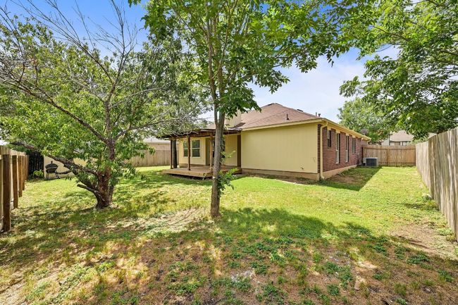 Back of house with a fenced backyard and a deck | Image 30