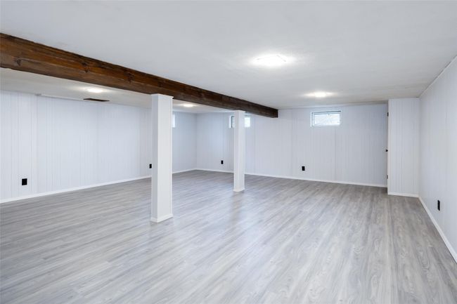 Basement featuring wood finished floors and baseboards | Image 32