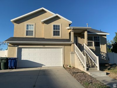 View of front of house featuring a garage | Image 1