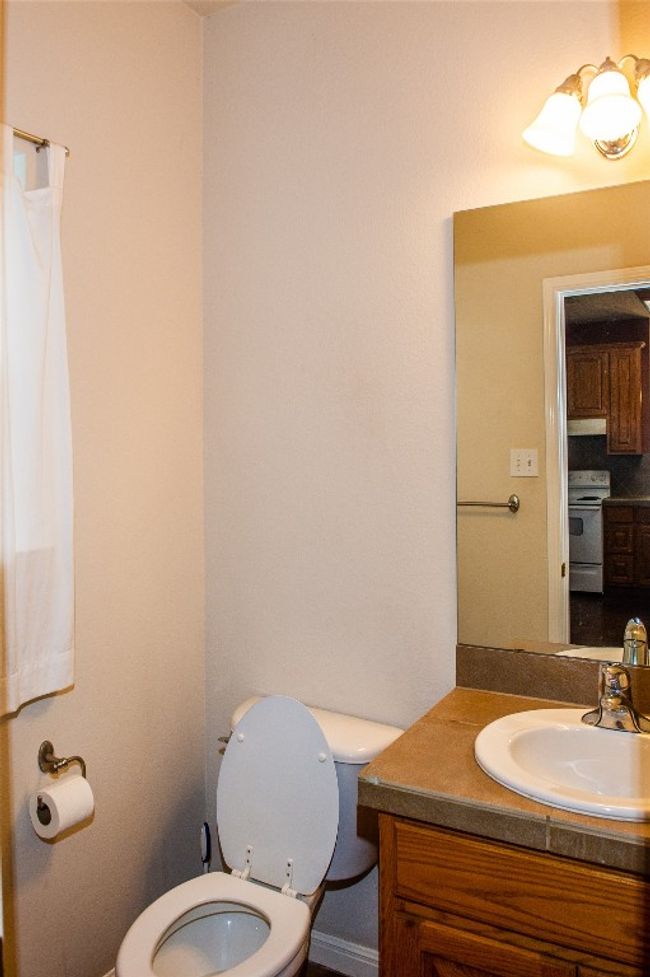 Half bathroom featuring vanity and backsplash | Image 9