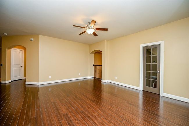Upstairs Game Room with the Door Leading to Huge Storage Room | Image 39