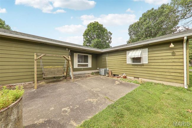 Back of property with crawl space, a lawn, and a patio | Image 26