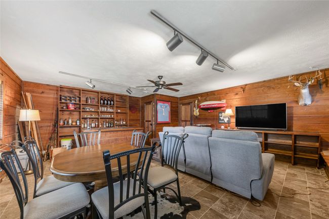 Enclosed garage made into a game/dining/media/ bar area | Image 20