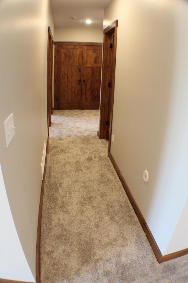 Basement Hall from family room leading back to stairs | Image 39
