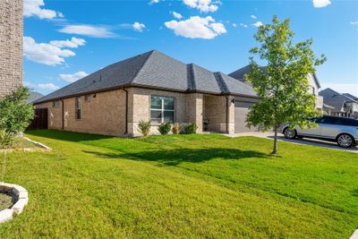 View of side of property with a lawn and a garage | Image 3