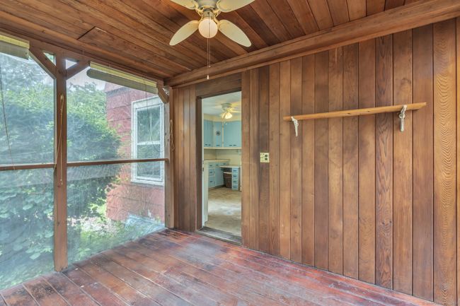 Tongue and groove ceiling door leading to kitchen | Image 8