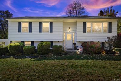 Split foyer home featuring a lawn | Image 1