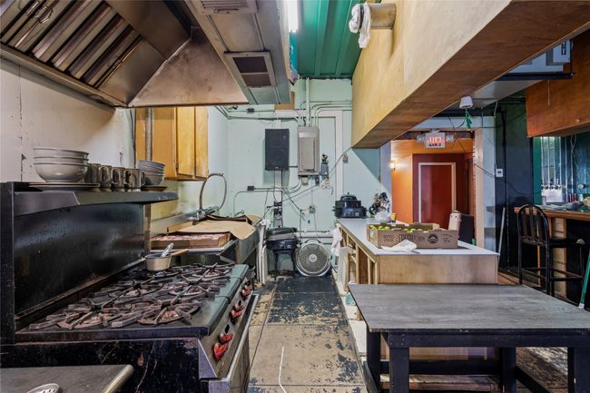 Kitchen featuring electric panel and gas stove | Image 17