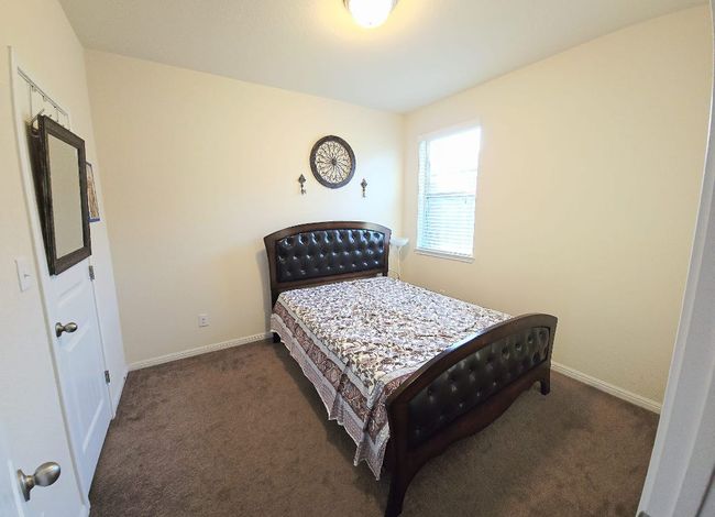 Bedroom featuring carpet and baseboards | Image 16