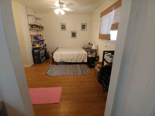 Bedroom with wood finished floors | Image 8