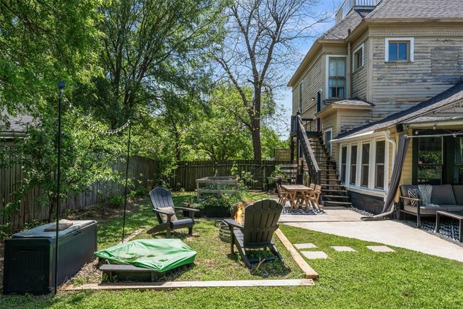 Fenced backyard featuring a patio area and stairway | Image 34