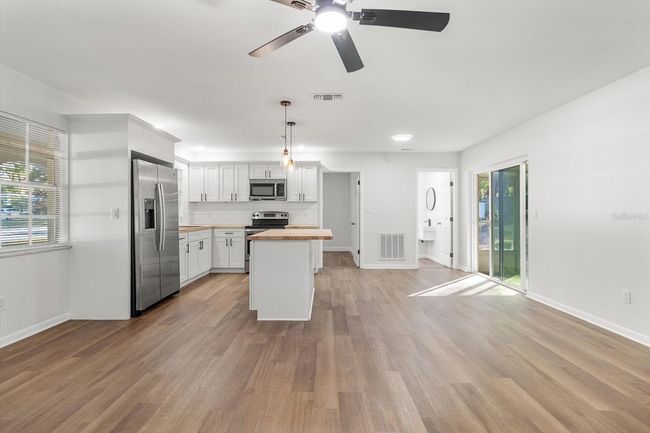 View from Front Door Toward the Kitchen/ Dining Area w/ Slider to the Enclosed Porch | Image 16
