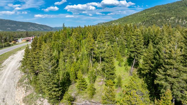 View of mountain background featuring a heavily wooded area | Image 74