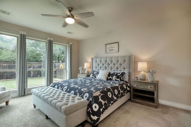 The primary suite has beautiful windows overlooking the backyard. | Image 11