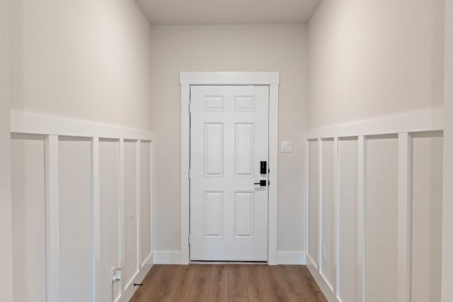 Doorway to outside with wood finished floors and baseboards | Image 4