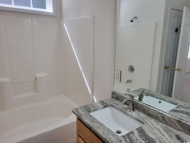 Full bath with vanity, shower combination, and plenty of natural light | Image 37