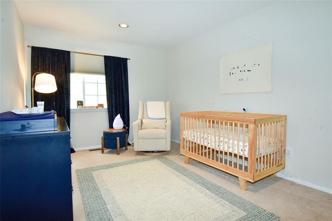 Bedroom featuring carpet flooring, baseboards, a crib, and recessed lighting | Image 13