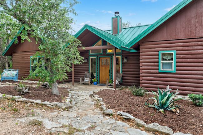 View of front of home featuring a chimney and metal roof | Image 5