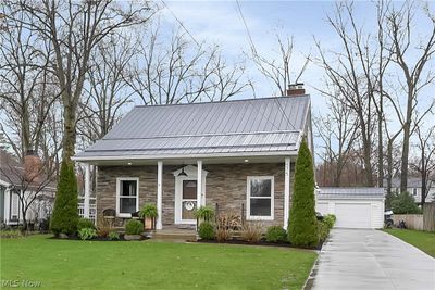 View of front of home featuring covered porch and a front yard | Image 2