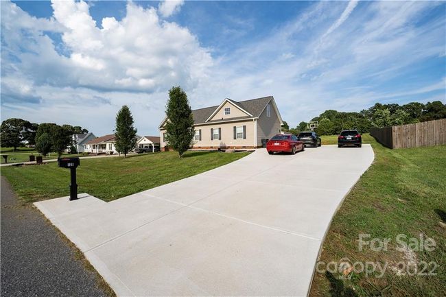 View from front right with newly paved concrete driveway | Image 4